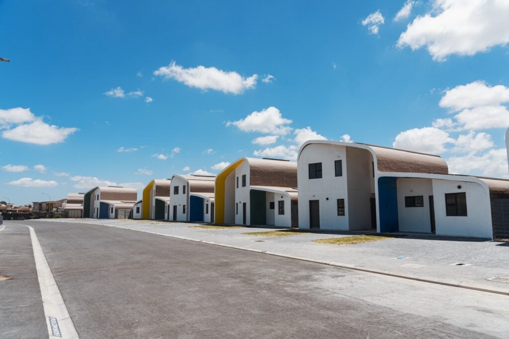 Modern residential houses with unique curved architecture in a new housing development.