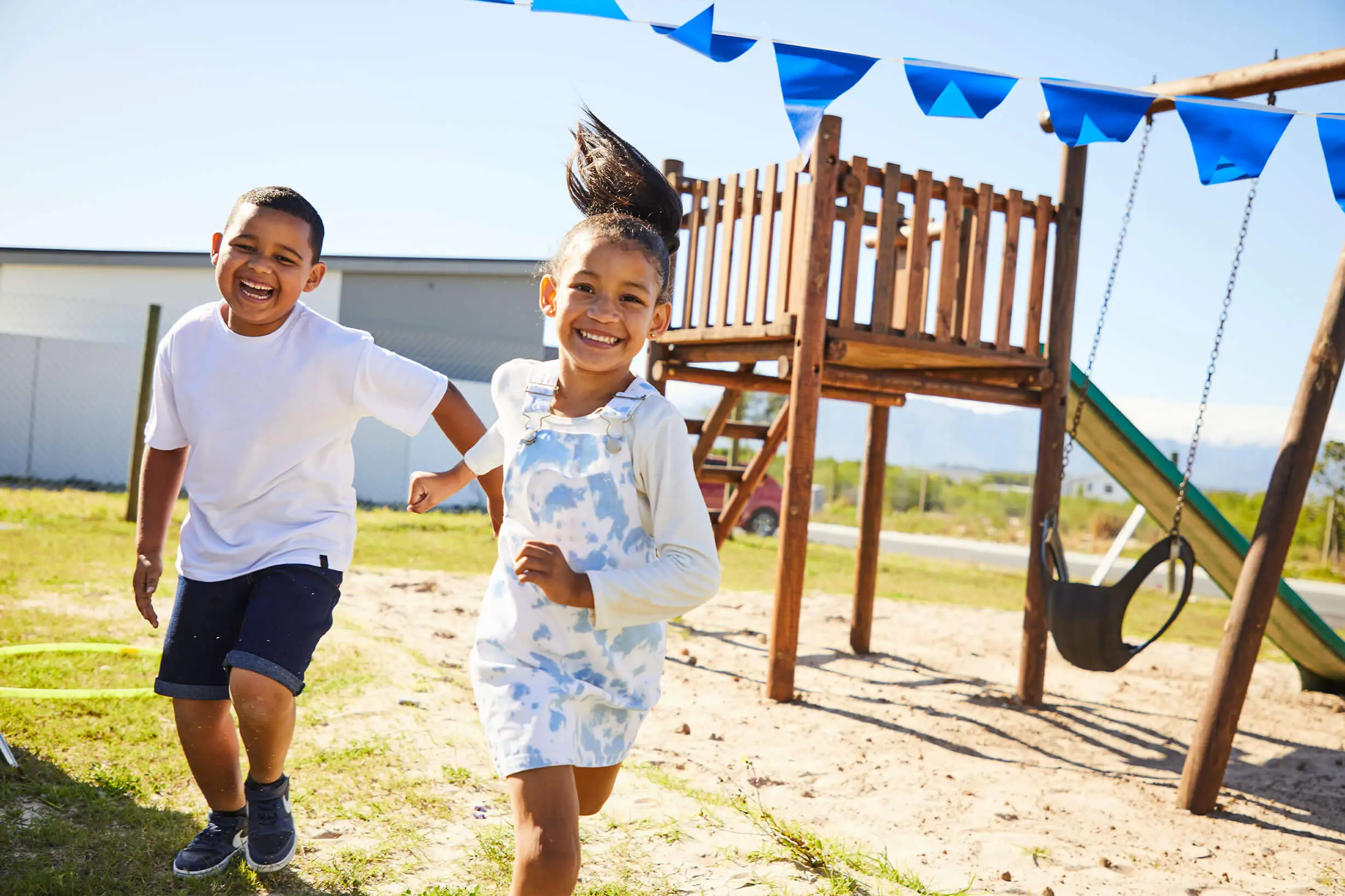 Social Impact brother-and-sister-running-through-park-together