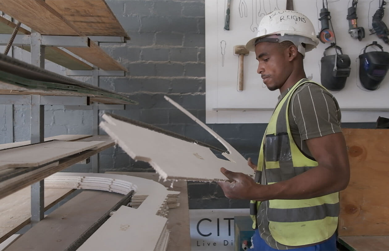 The Meaning Behind Citra Construction worker in safety gear inspecting building materials at Citra.