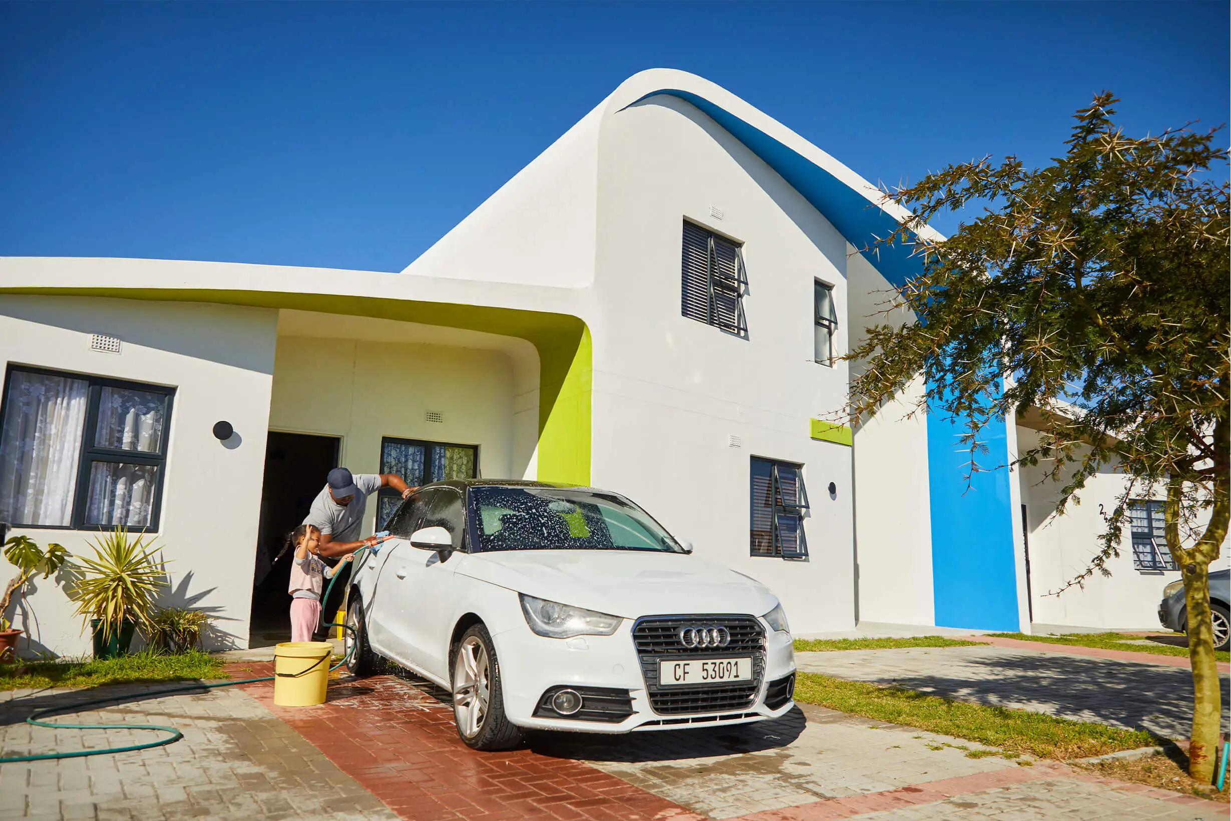 Social Impact father-and-daughter-washing-car-in-driveway